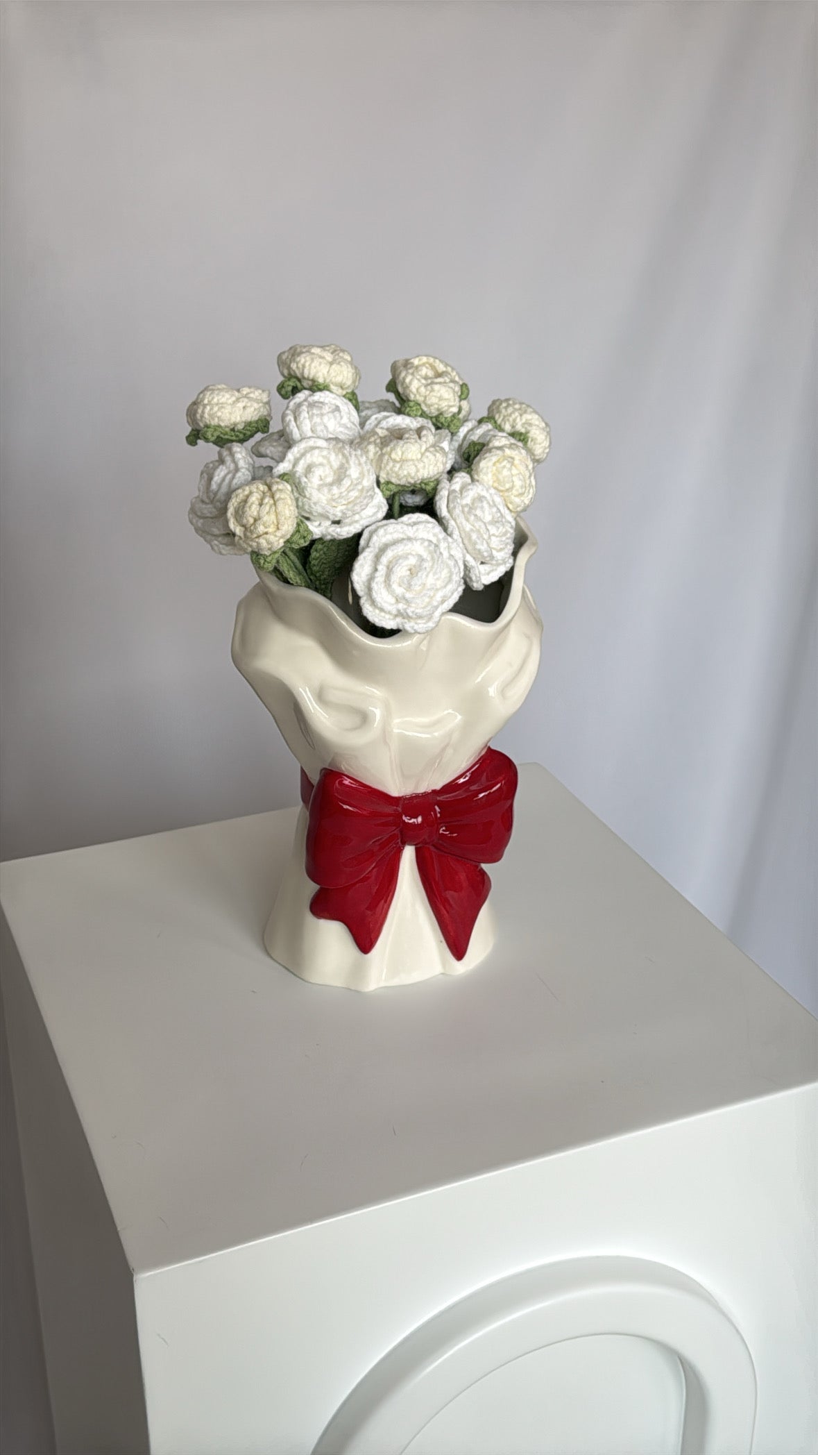 red bow vase