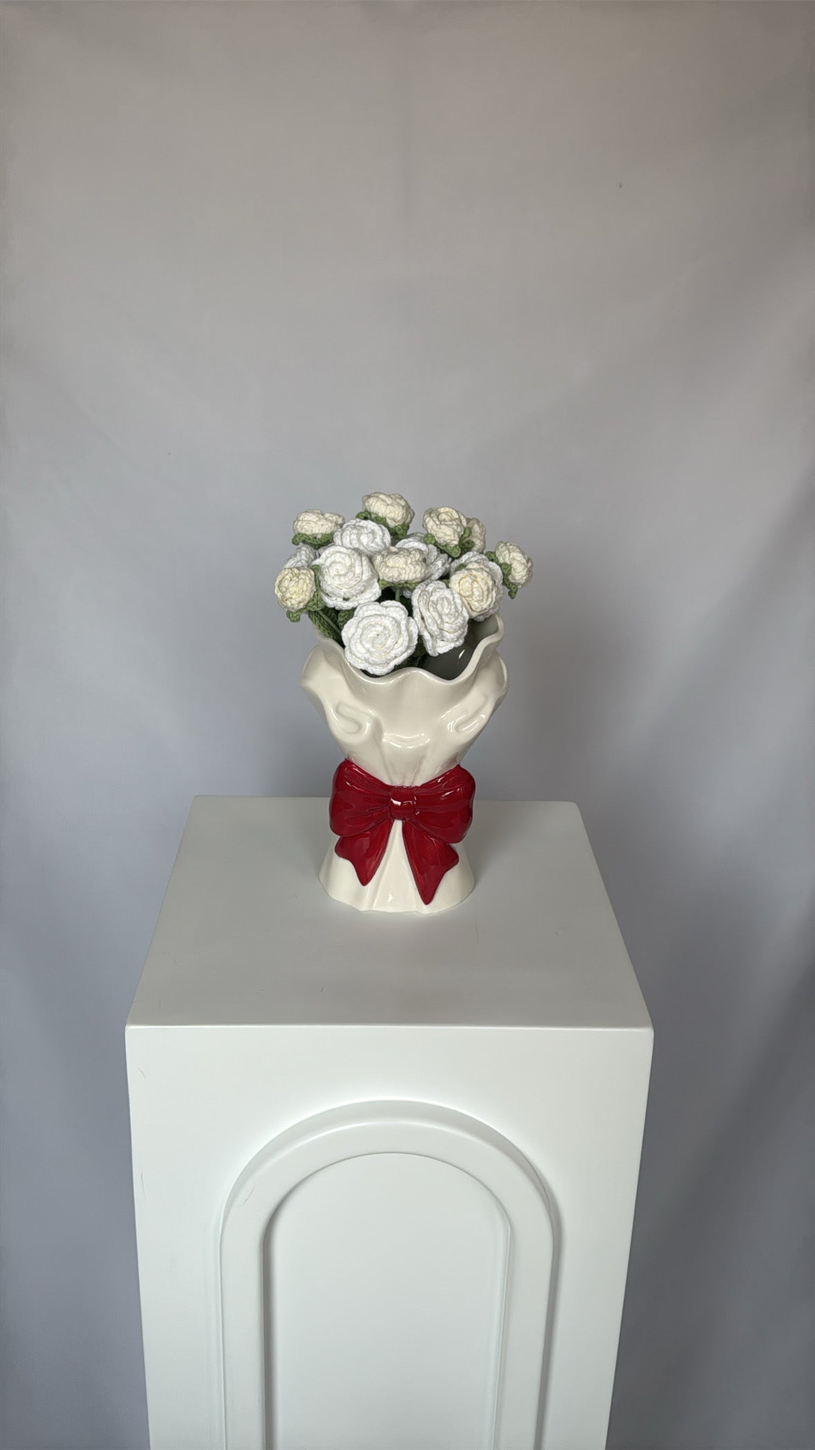 red bow vase