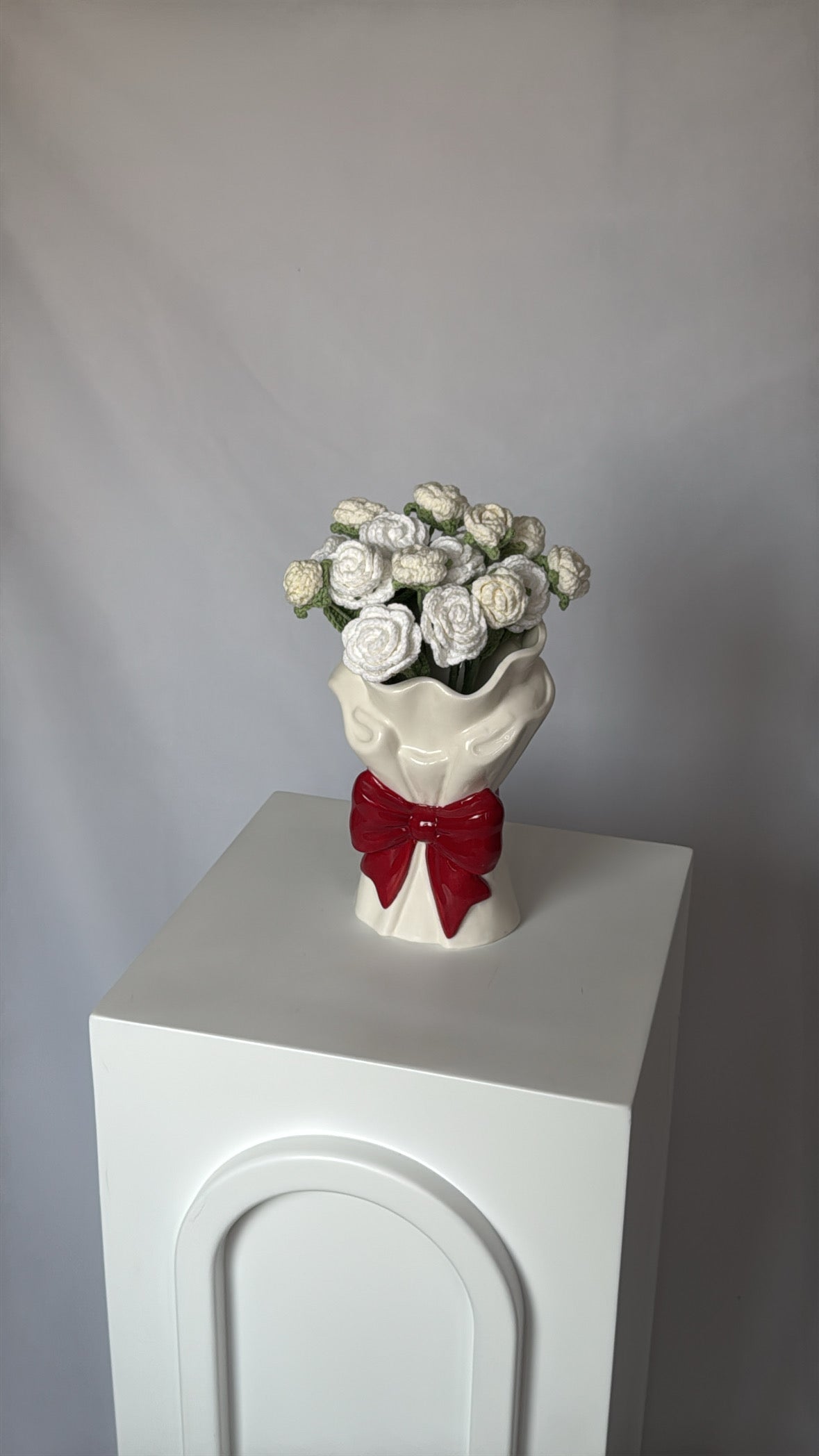 red bow vase